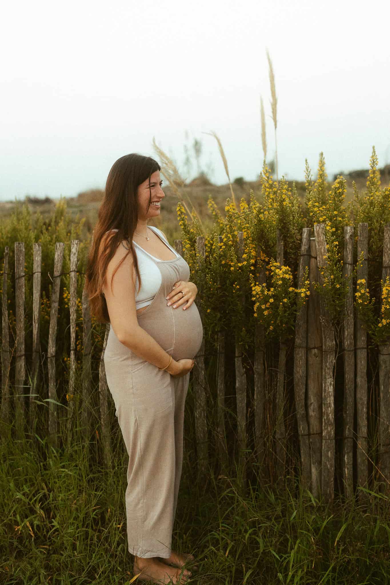 Maternity photoshoot surrounded by flowers
